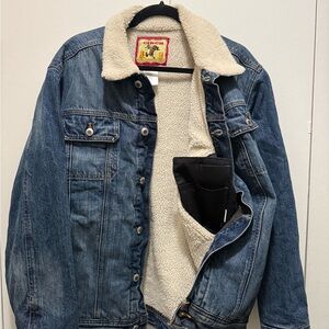 Cinch Blue Denim Jacket with Cream Sherpa Lining with conceal weapon pockets.